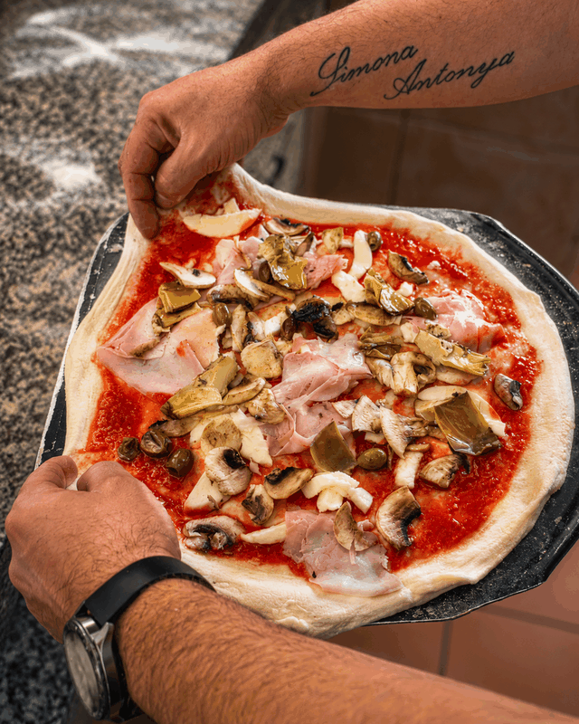 La Partenope pizza preparation in the kitchen