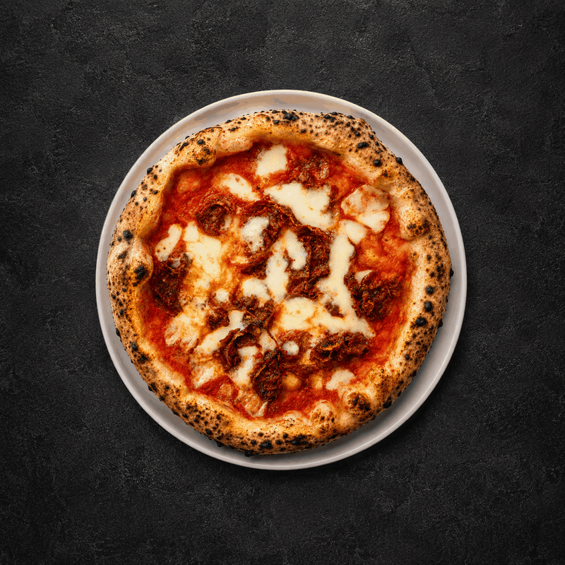 Diavola pizza with spicy salami at LaPartenope in Ipsos, Corfu